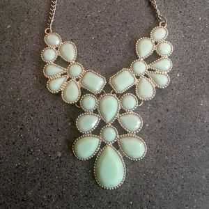 Gold and green coloured necklace